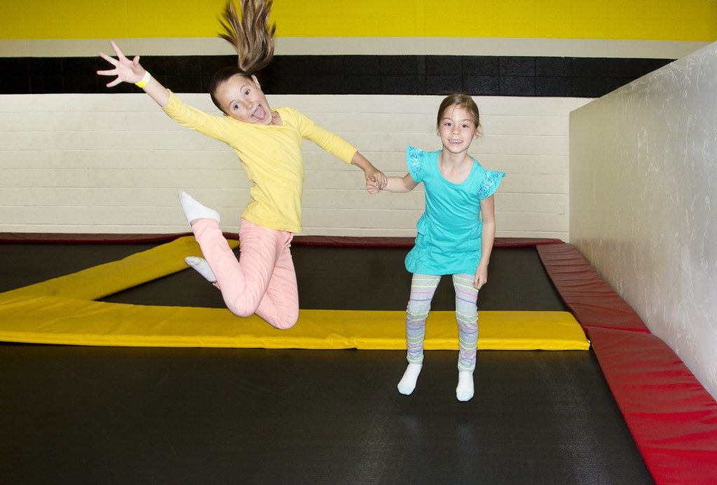 Kids Jumping on Indoor Trampolines