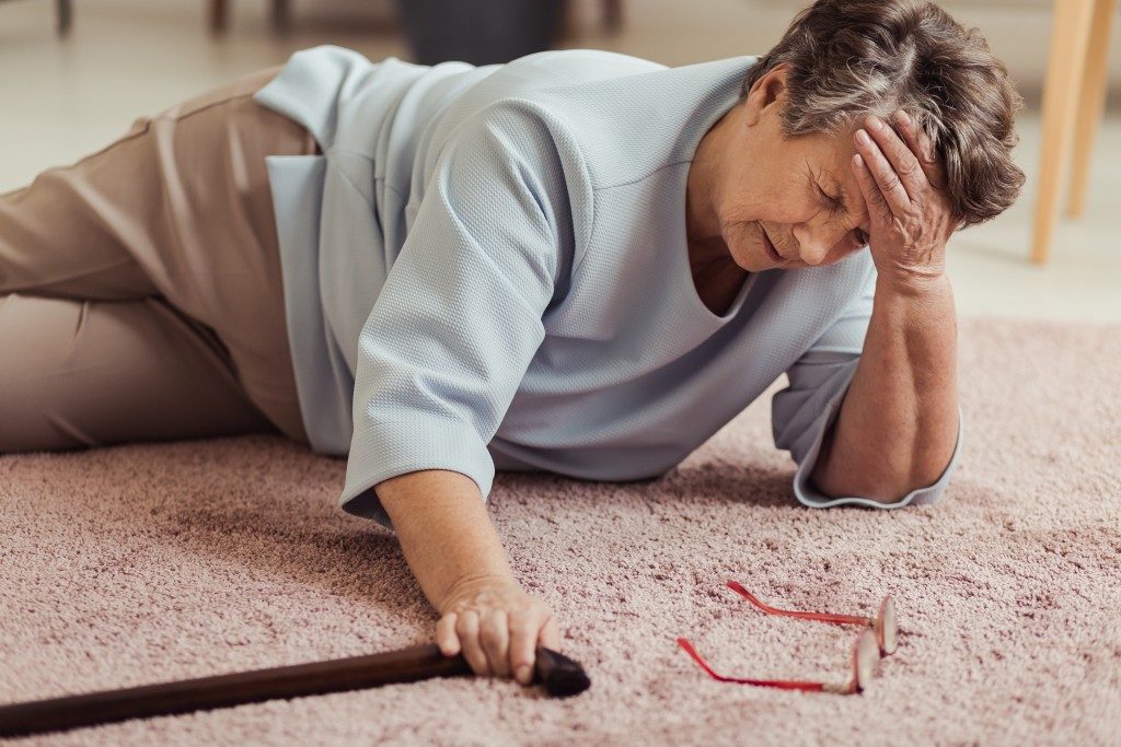 elderly woman on the floor after tripping