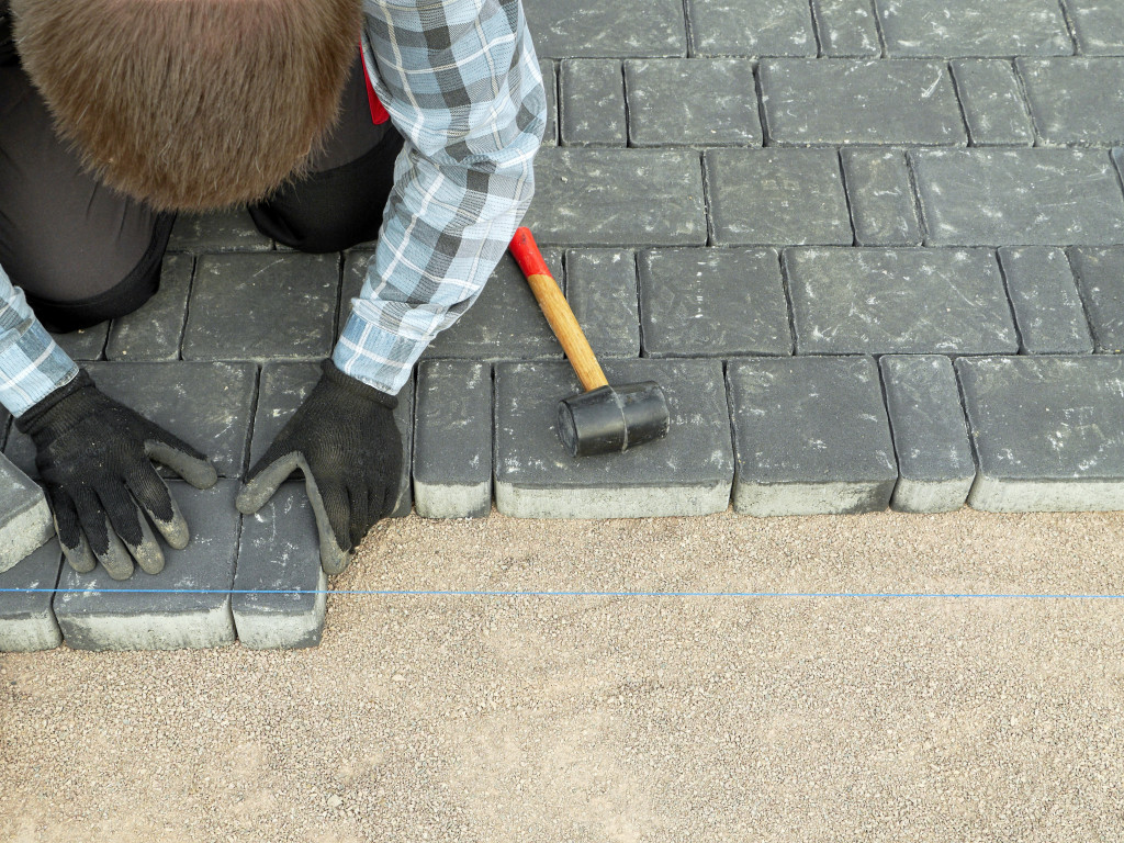 a person setting tiles