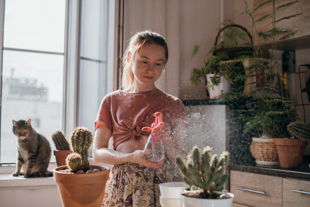 woman taking care of her plants
