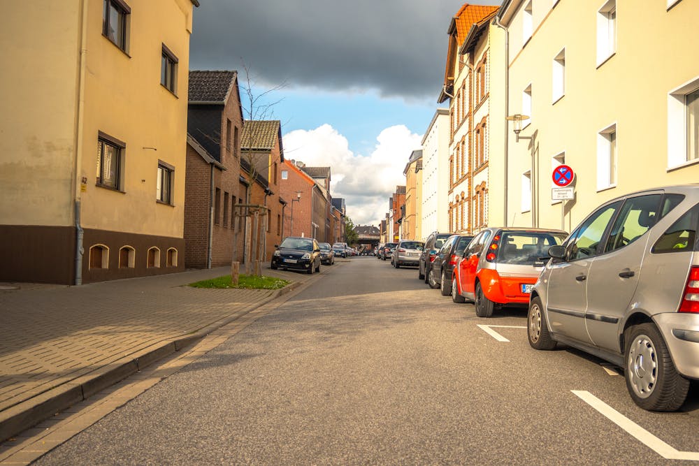 cars parked outside urban homes